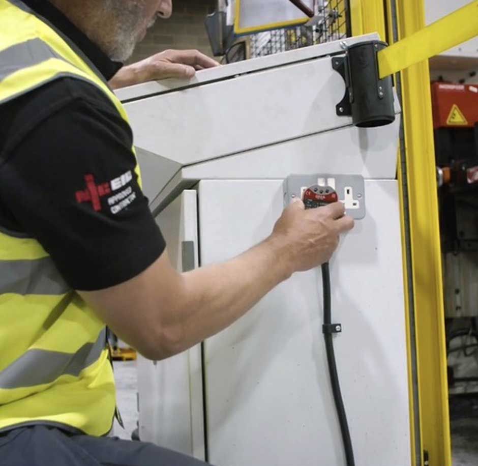 A CTE expert electrician carrying out a Free Commercial Energy Survey at a Huddersfield business
