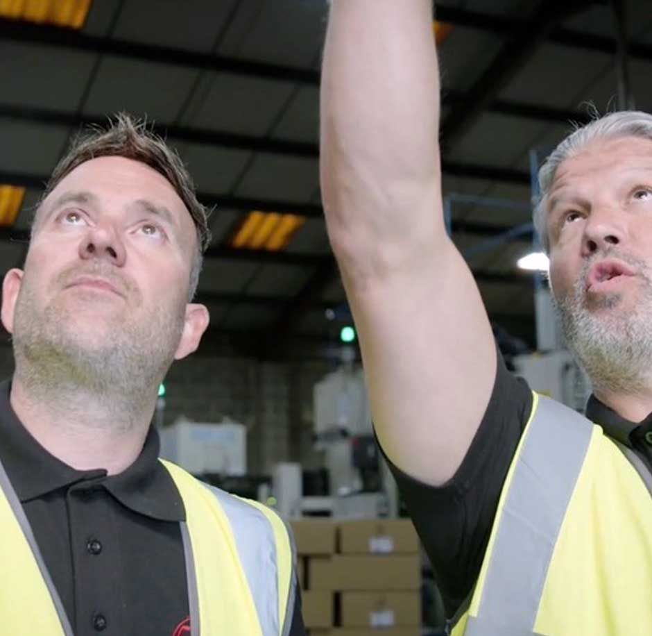 Chris Thompson - Managing Director at CTE Electrical Contractors - and a member of his expert electrician team discussing energy saving lighting at a busy Sheffield business