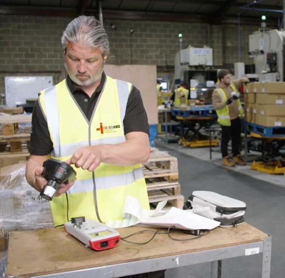 One of the expert electricians at CTE Electrical Contractors carrying out a Free Energy Saving Survey at a Leeds factory