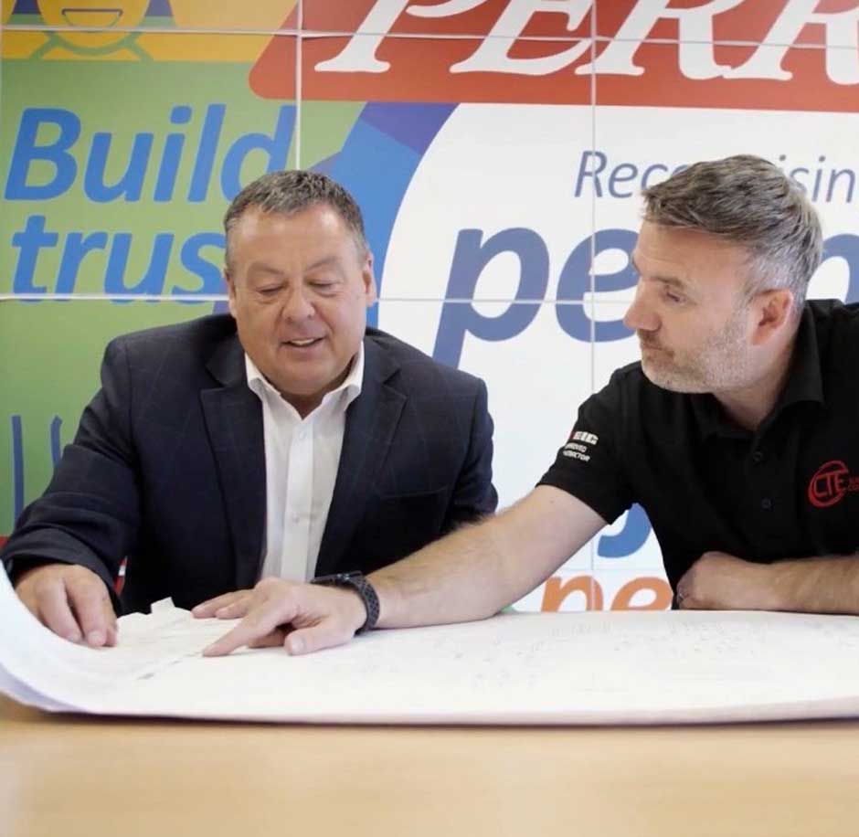 Chris Thompson - Managing Director at CTE Electrical Contractors - discussing a new energy saving project with a Leeds business owner